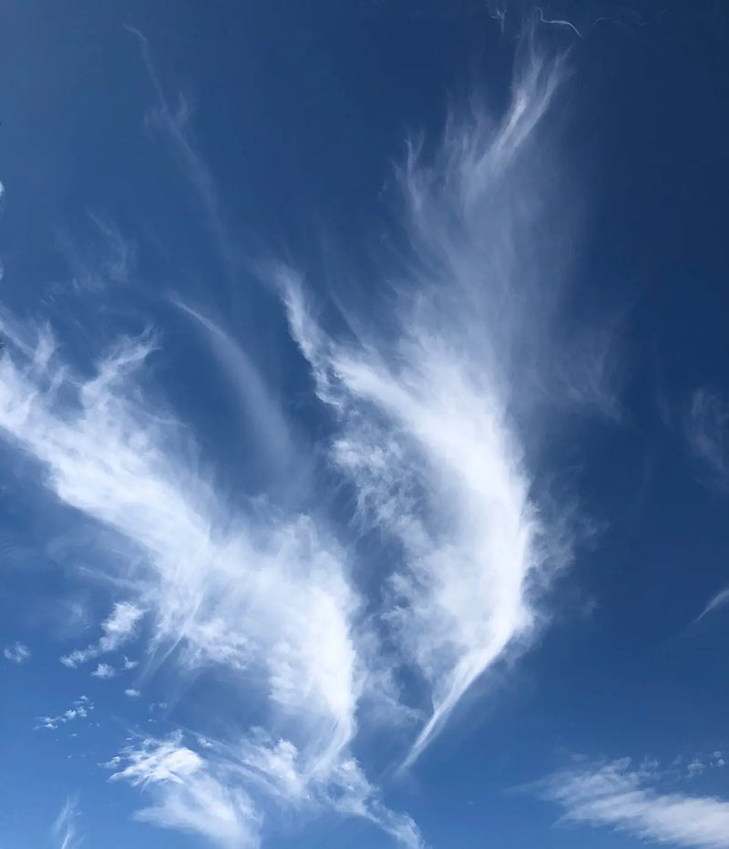 a blue sky with some clouds in it