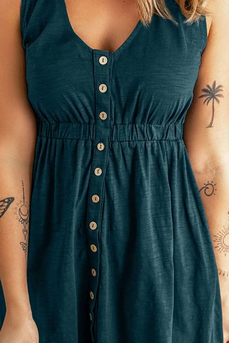 a woman wearing a green dress with a tattoo on her arm