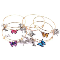 a set of four bracelets with butterflies on them