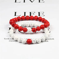 two bracelets with red and white beads
