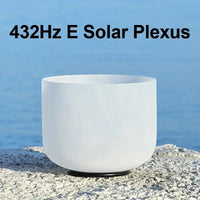 a white singing bowl sitting on a stone 432Hz E Solar Plexus