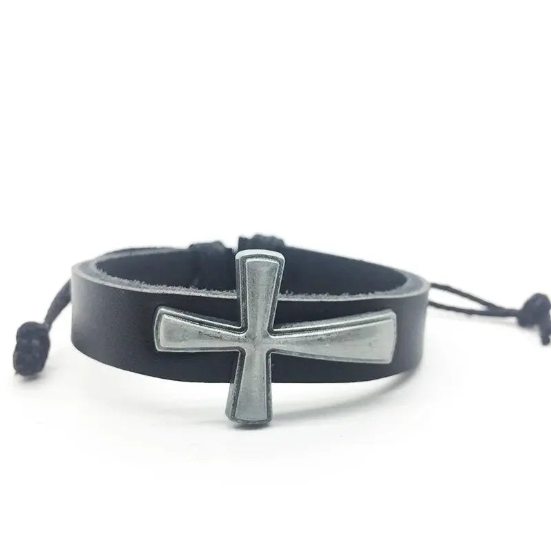 a black leather bracelet with a silver cross on it