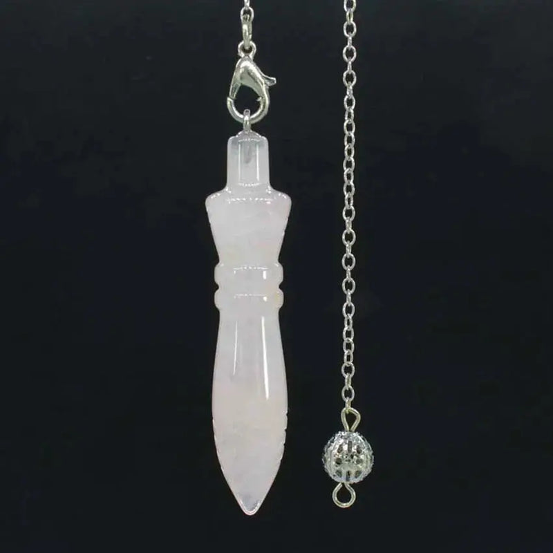 a white necklace with a pendant attached to it