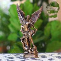 a figurine of an angel on a table