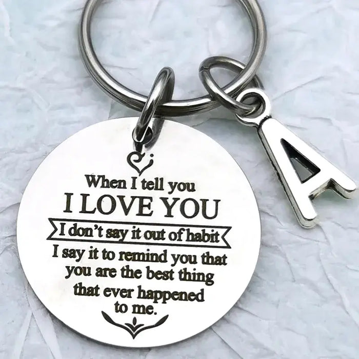 a metal keychain with a poem on it