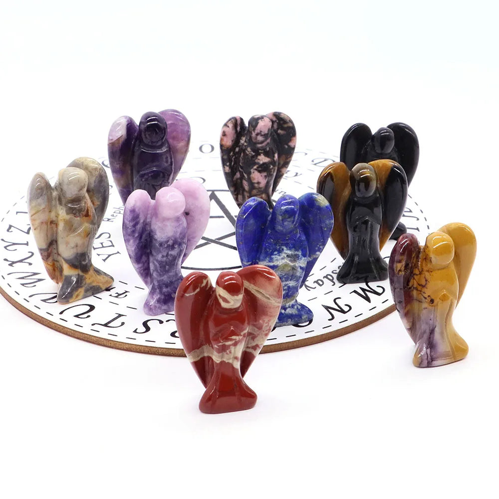 a group of small figurines sitting on top of a clock