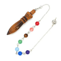 a necklace with beads and a pen on it