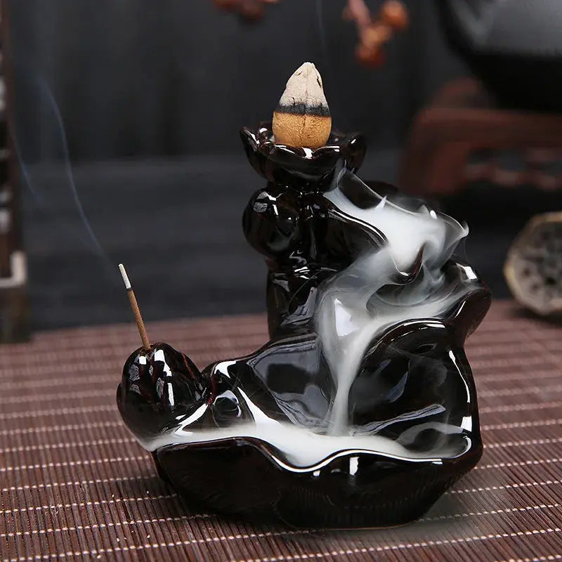 a black and white statue of a smoking man