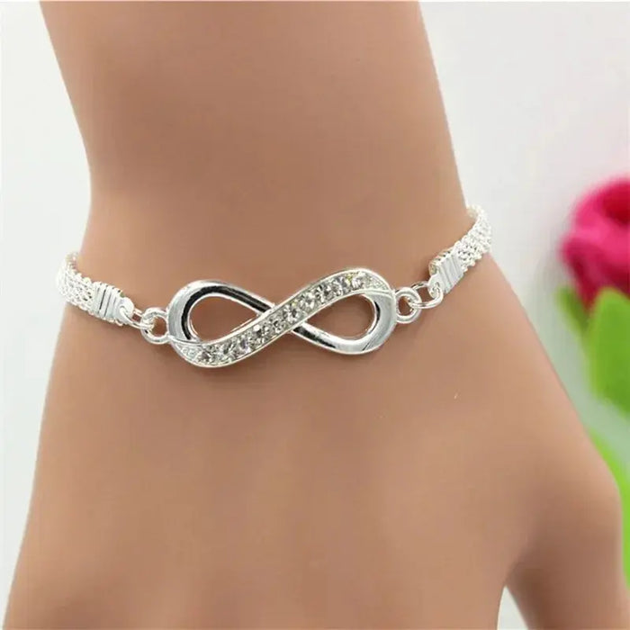 a silver bracelet with an infinity symbol on it