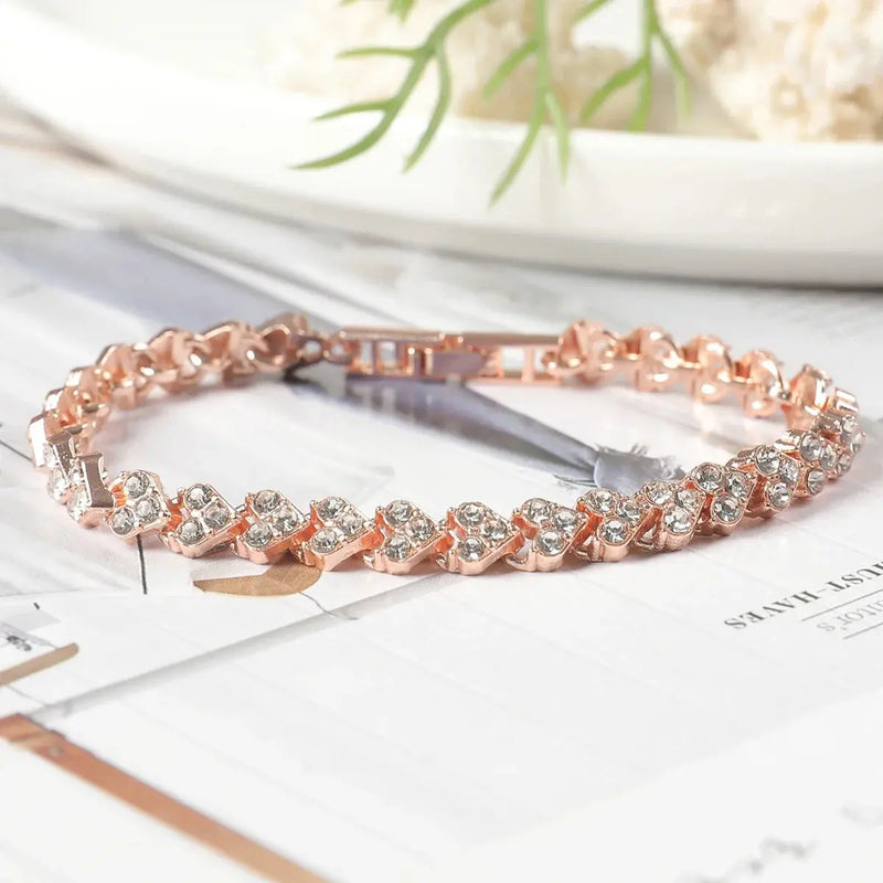 rose gold bracelet with rhinestones placed in heart shape