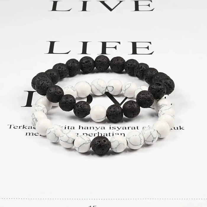 a couple of bracelets with black and white beads
