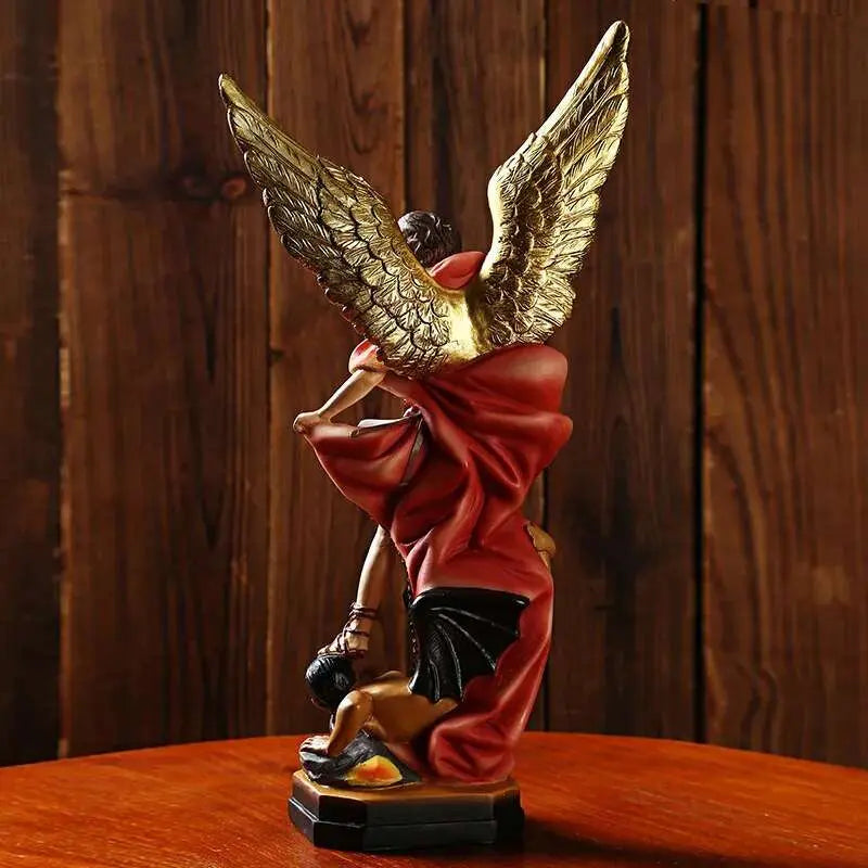 a figurine of an angel on a wooden table