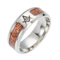 a stainless steel ring with a wooden inlay