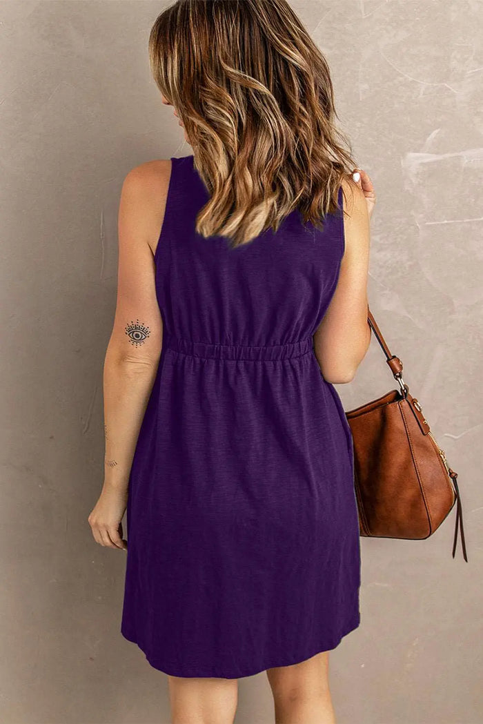 a woman in a purple dress holding a brown purse