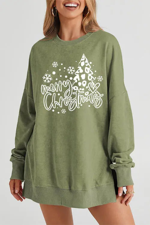 a woman wearing a green sweatshirt that says merry christmas